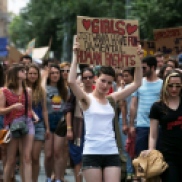 A woman holds a placard during a "Slut Walk" protest in Jerusalem