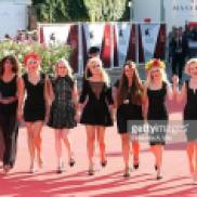 VENICE, ITALY - SEPTEMBER 05: FEMEN activists Inna Shevchenko (C) and Sasha Shevchenko (2nd R) arrive on the red carpet before the "Sacro GRA" Premiere during the 70th Venice International Film Festival at the Palazzo del Casino on September 5, 2013 in Venice, Italy. (Photo by Elisabetta A. Villa/WireImage)